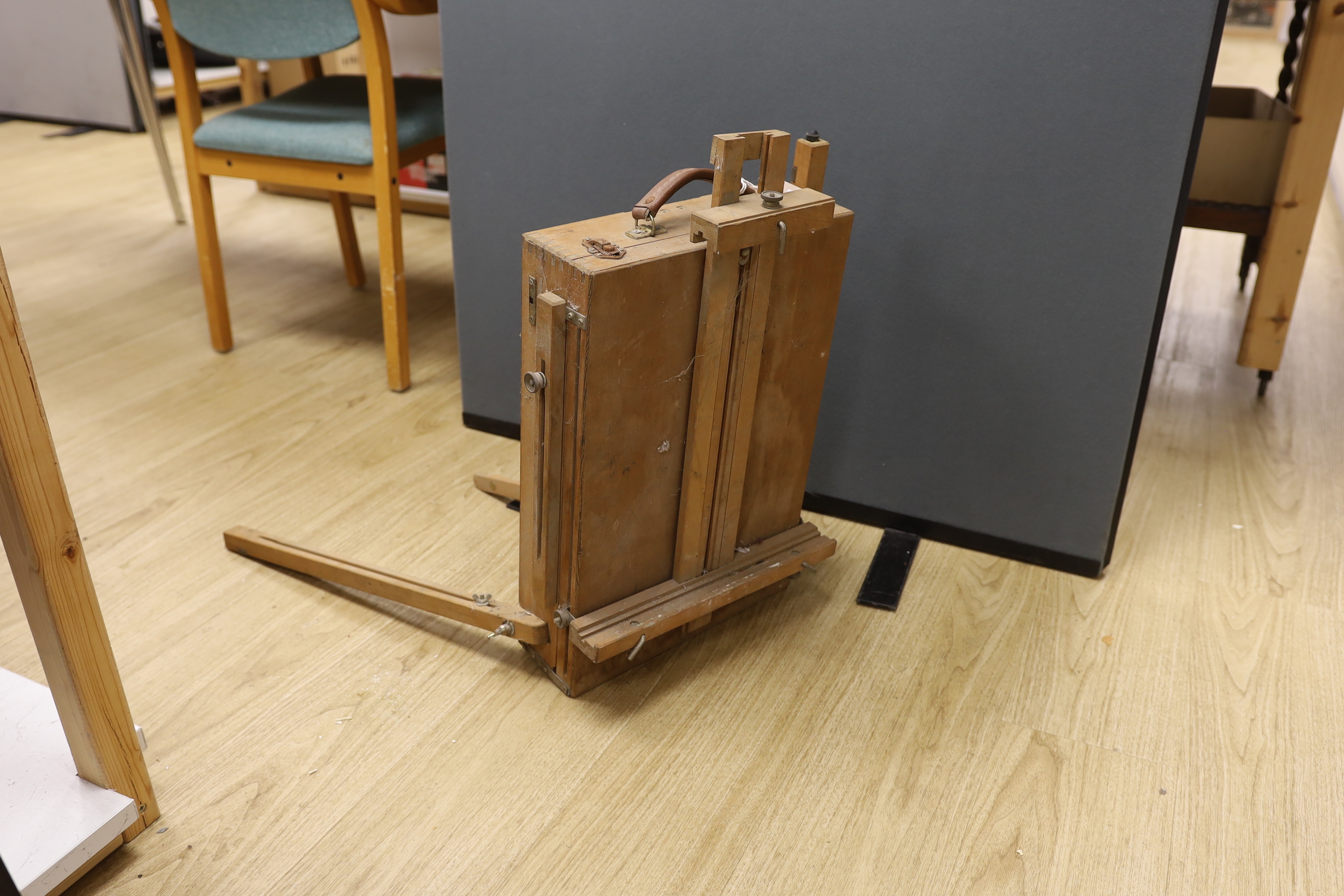 A travelling easel stamped ‘M abef made in Italy’